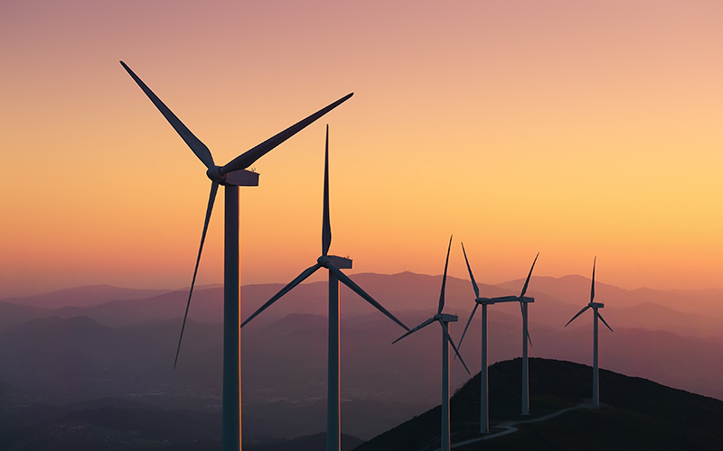 Wind turbines at sunset