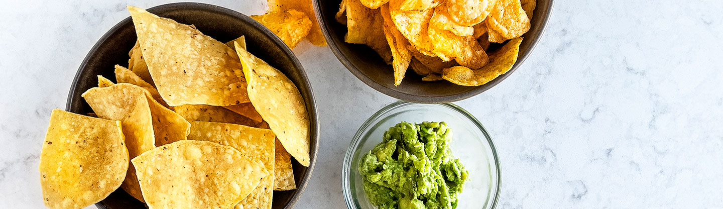 A selection of healthy snacks including Guacamole