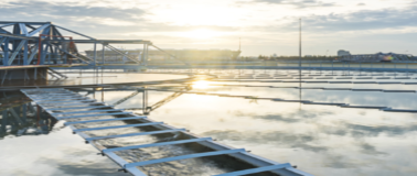 Sunrise over a water treatment facility