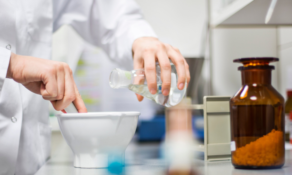 A scientist mixing pharmaceutical formulations in the laboratory